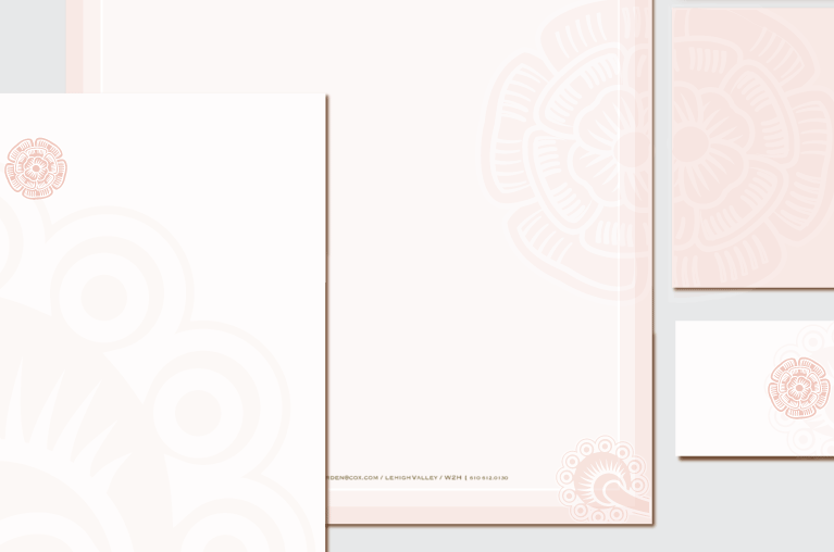 third close-up of letterhead package with the flower logo