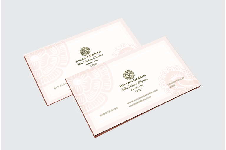 two business cards with the flower logo